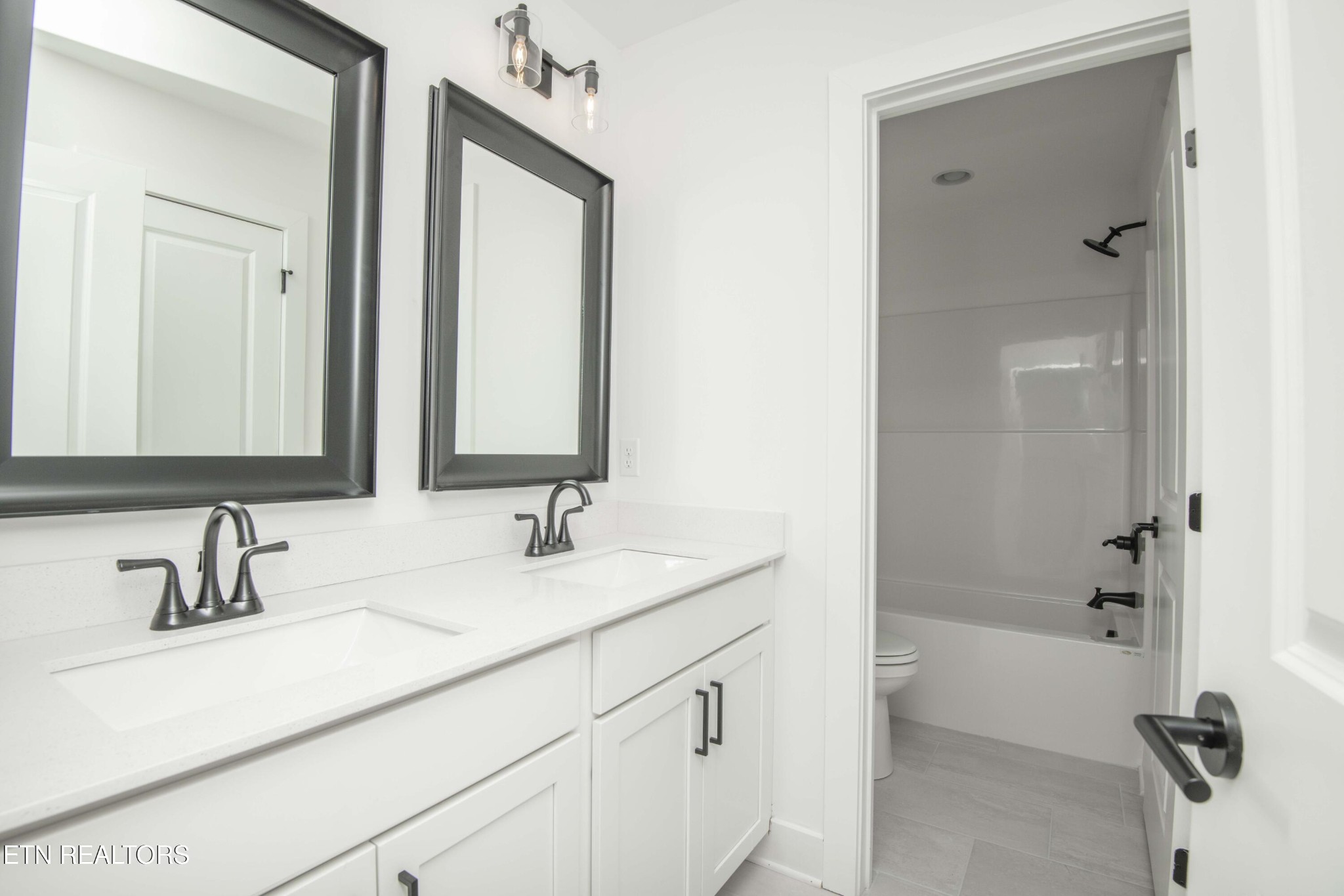 420 Ivey Farms Road Knoxville, TN 37934 - Photo 41 of 56 a bathroom with a double vanity sink mirror double and shower