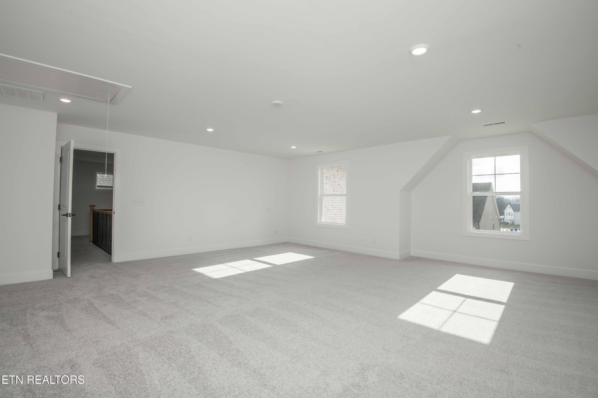 420 Ivey Farms Road Knoxville, TN 37934 - Photo 44 of 56 an empty room with windows and fireplace