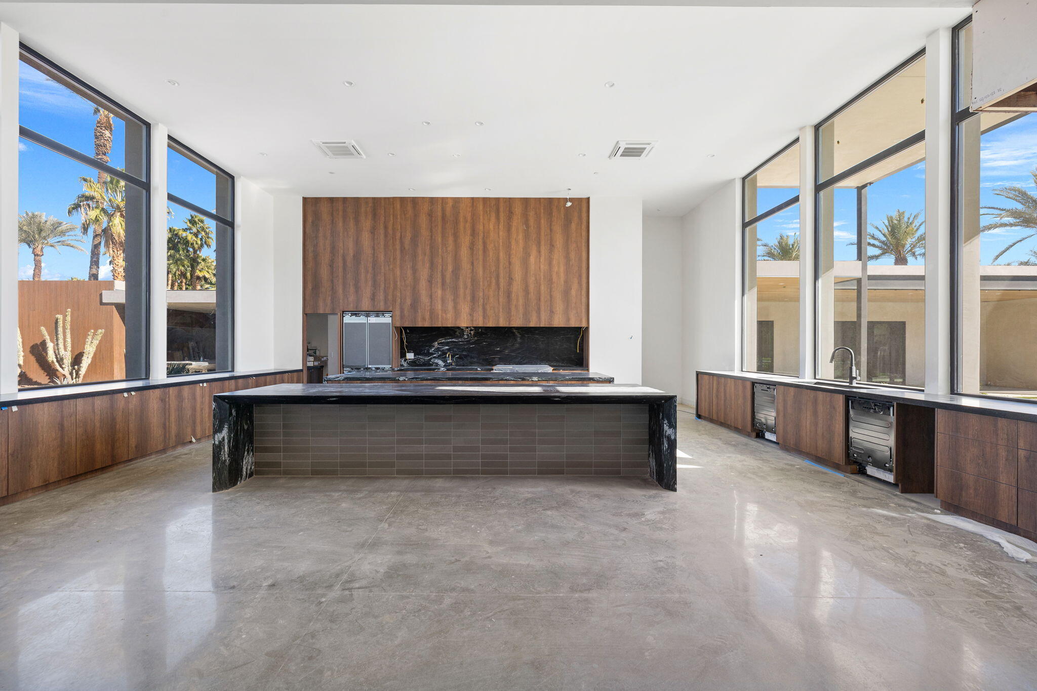 3 Shakespeare Court Rancho Mirage, CA 92270 - Photo 16 of 35 a living room with a large window and furniture