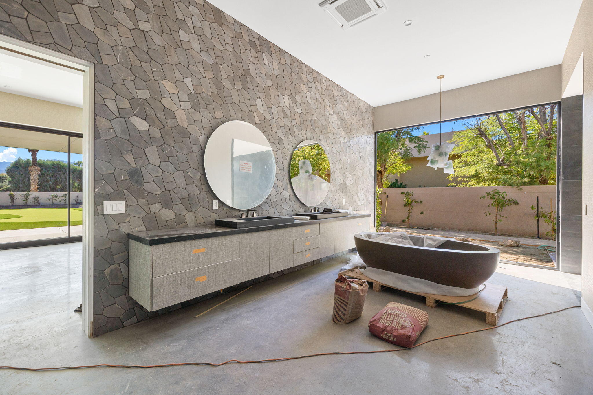 3 Shakespeare Court Rancho Mirage, CA 92270 - Photo 20 of 35 a living room with a couch and a table