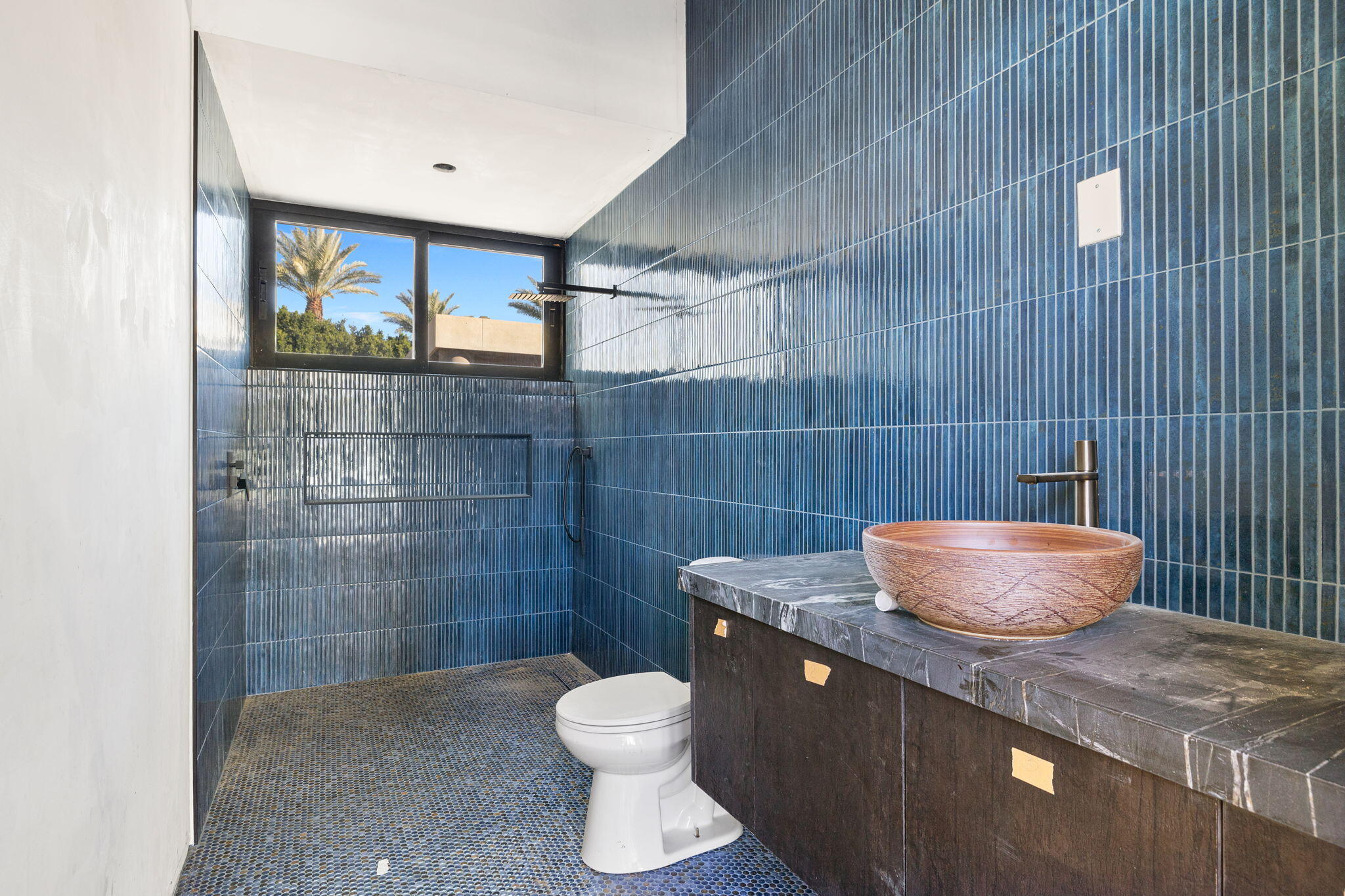 3 Shakespeare Court Rancho Mirage, CA 92270 - Photo 25 of 35 a bathroom with a granite countertop toilet and a sink