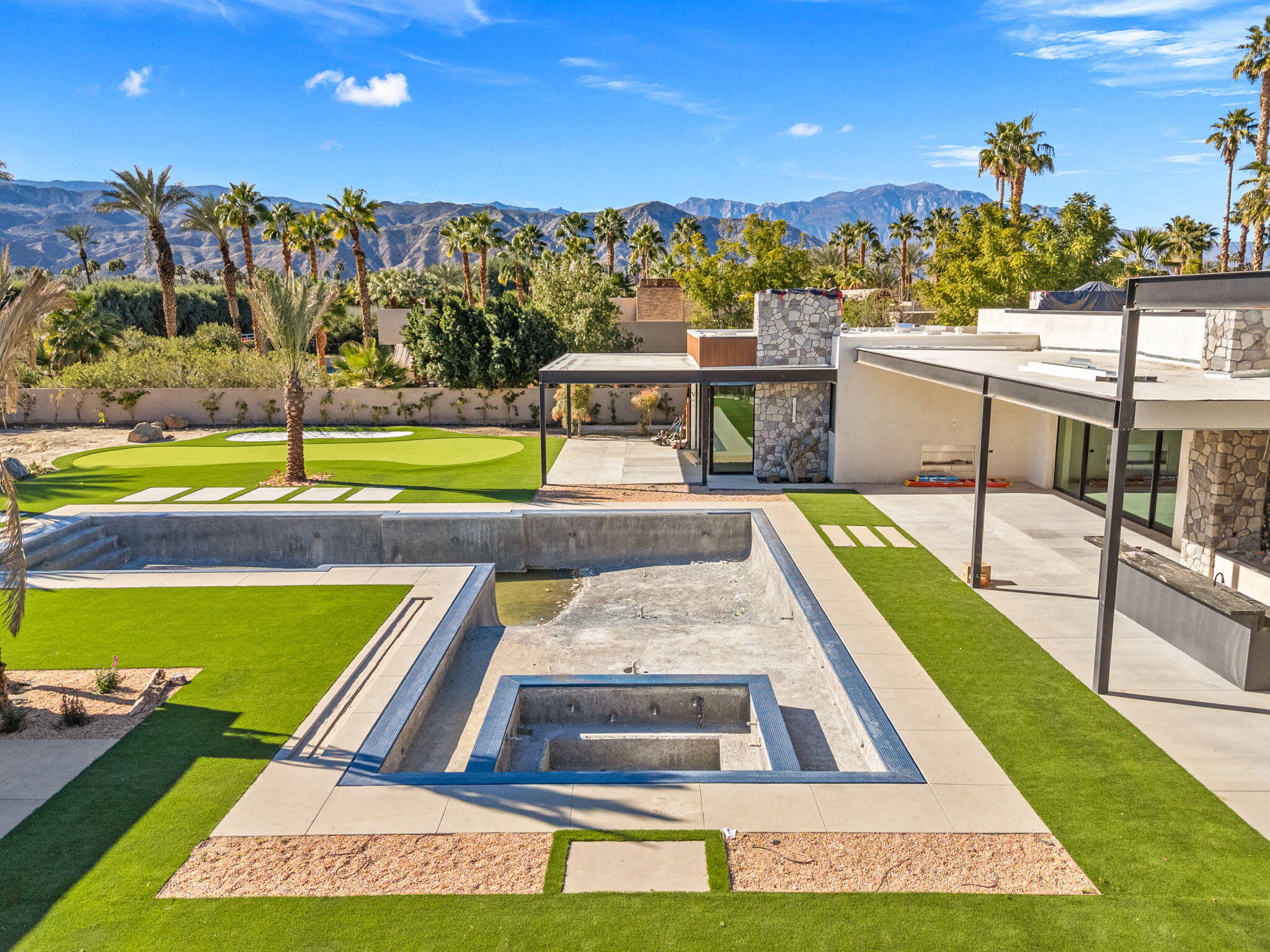 3 Shakespeare Court Rancho Mirage, CA 92270 - Photo 26 of 35 a view of a swimming pool with an outdoor seating