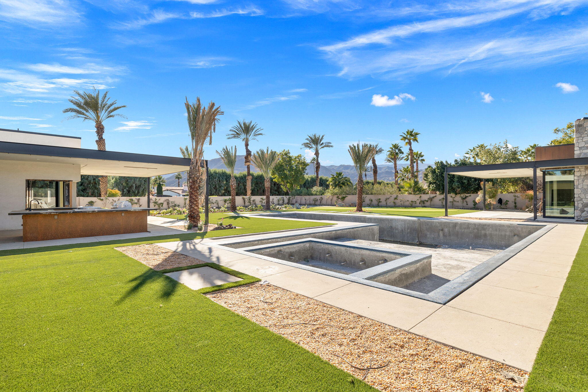 3 Shakespeare Court Rancho Mirage, CA 92270 - Photo 28 of 35 a view of swimming pool with outdoor seating and a patio