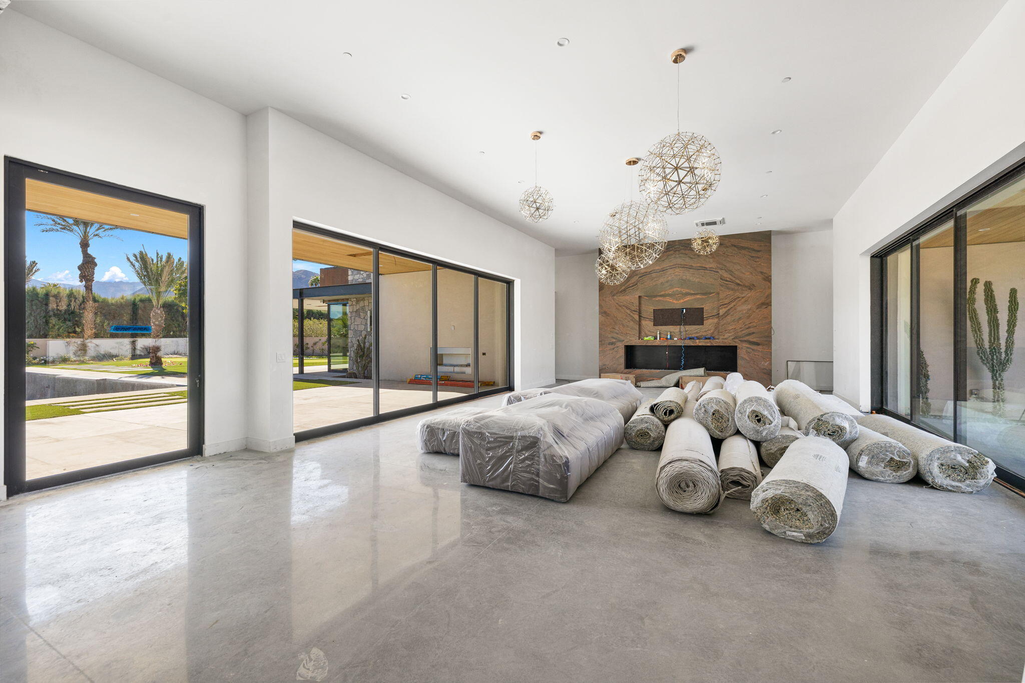 3 Shakespeare Court Rancho Mirage, CA 92270 - Photo 5 of 35 a spacious bedroom with a bed and a large window
