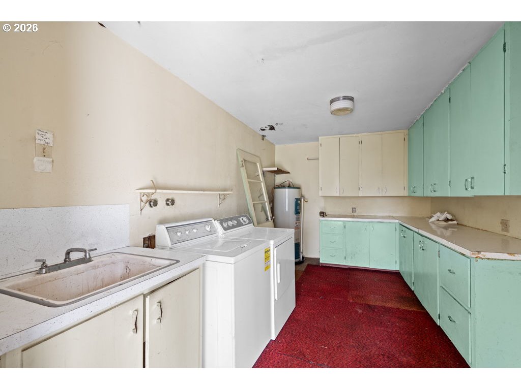 5235 Brickyard Road Tillamook, OR 97141 - Photo 8 of 14 a kitchen that has a sink and a stove in it
