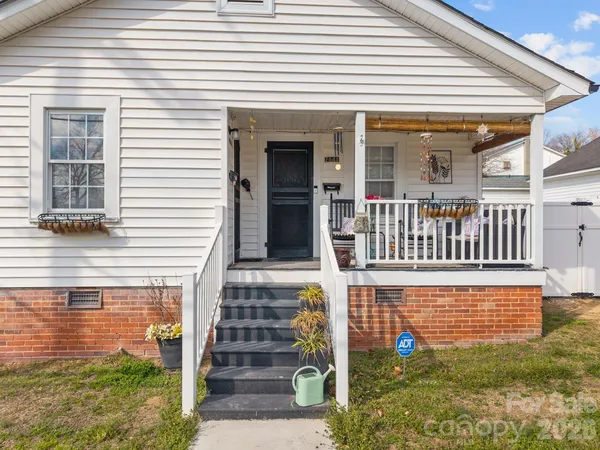 a view of a house with porch and wooden floor