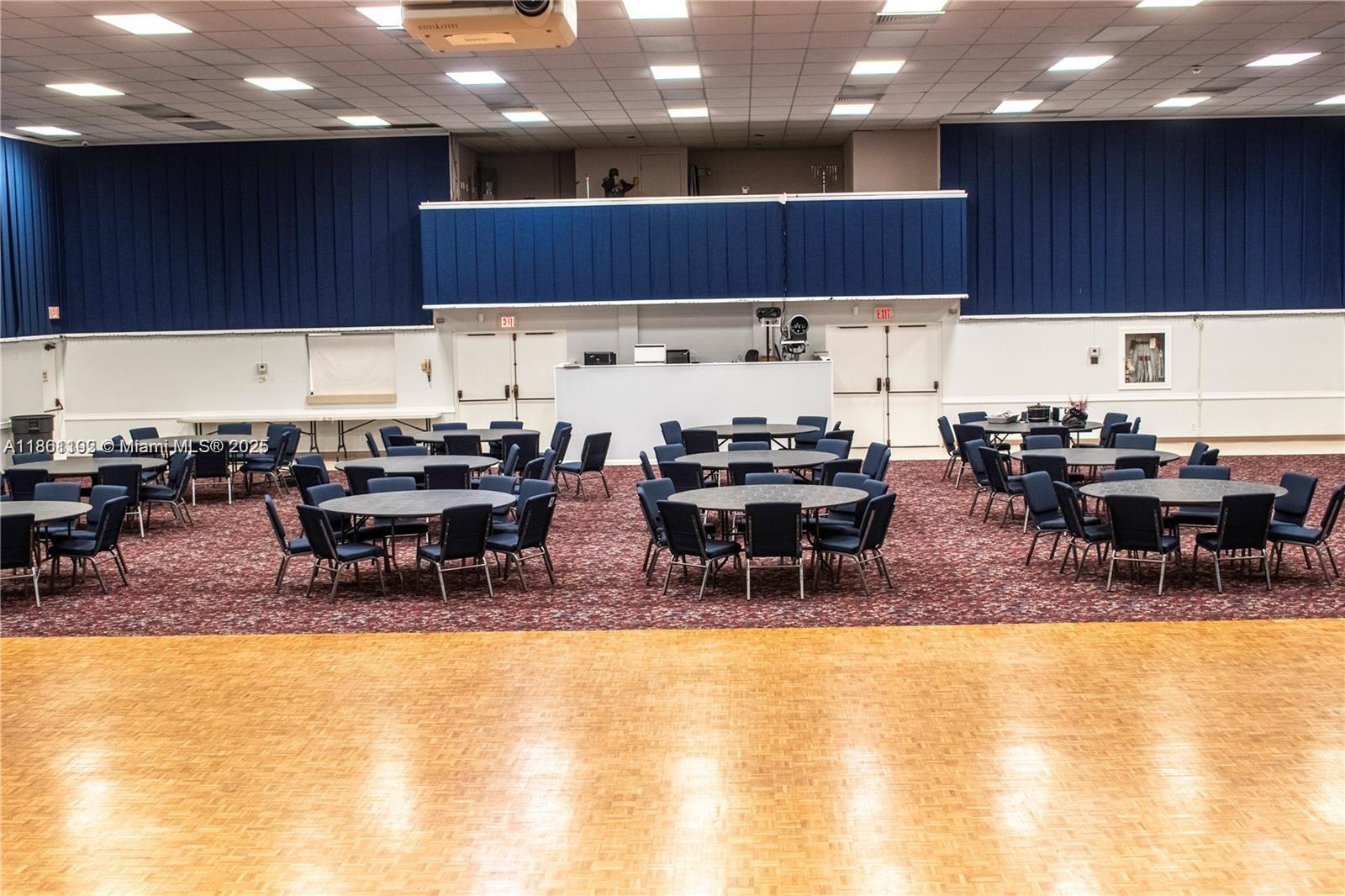 3090 Holiday Springs Boulevard, Unit 206 Margate, FL 33063 - Photo 11 of 41 a kitchen with lots of chairs and view living room