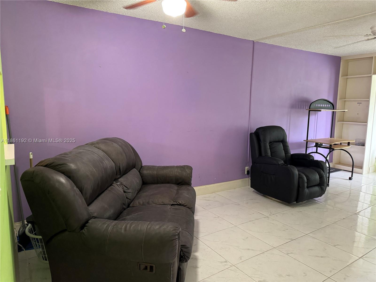 3090 Holiday Springs Boulevard, Unit 206 Margate, FL 33063 - Photo 21 of 41 a living room with furniture