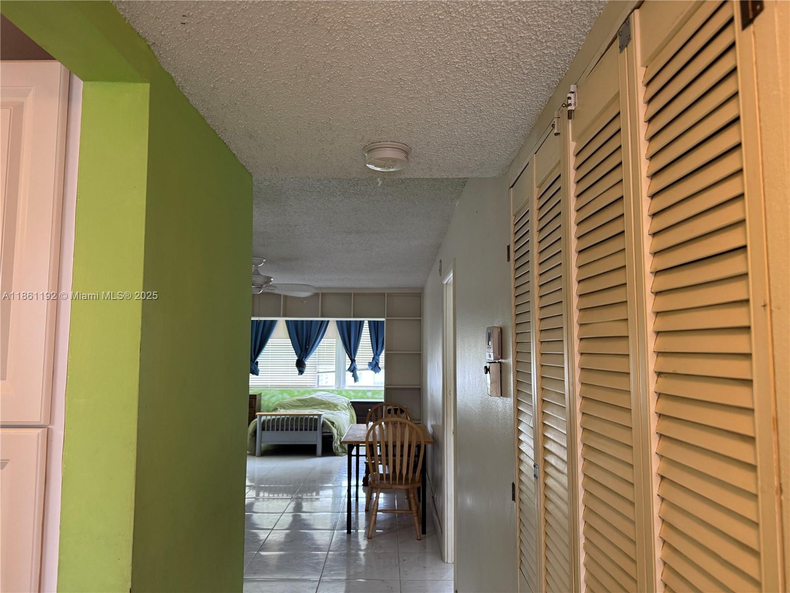 3090 Holiday Springs Boulevard, Unit 206 Margate, FL 33063 - Photo 28 of 41 a view of a balcony a door and wooden floor