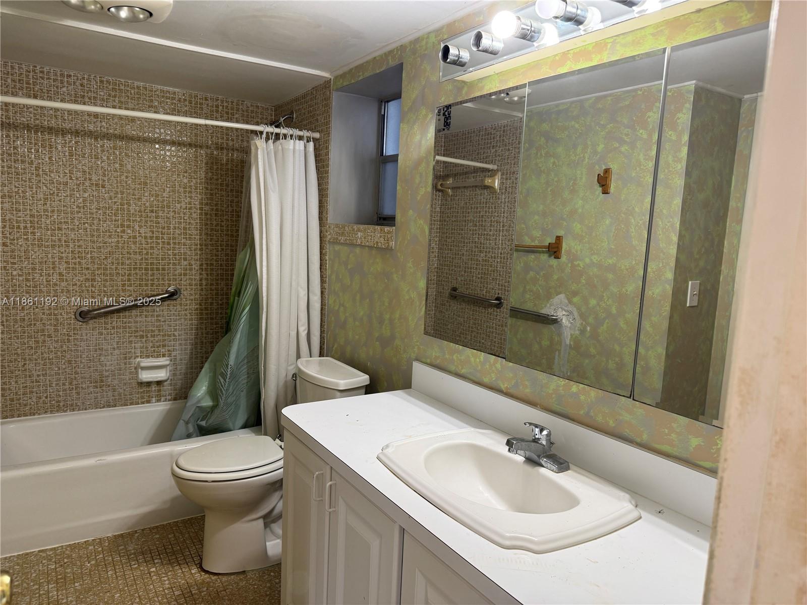 3090 Holiday Springs Boulevard, Unit 206 Margate, FL 33063 - Photo 30 of 41 a bathroom with a sink toilet and shower