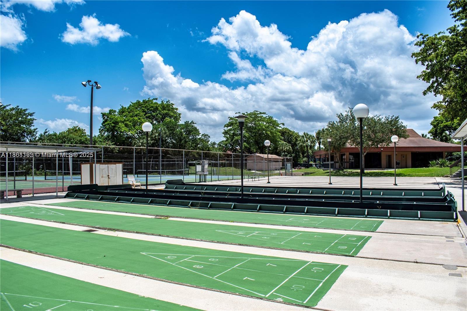 3090 Holiday Springs Boulevard, Unit 206 Margate, FL 33063 - Photo 7 of 41 a view of a garden