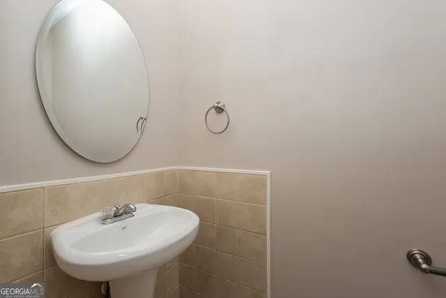 a bathroom with a sink and mirror