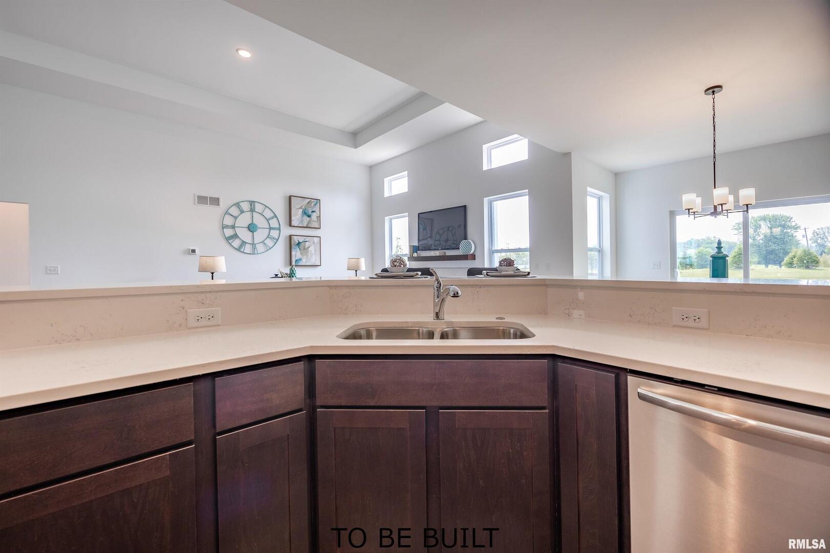 10 South 5th Street Eldridge, IA 52748 - Photo 11 of 29 a kitchen with a sink cabinets and window