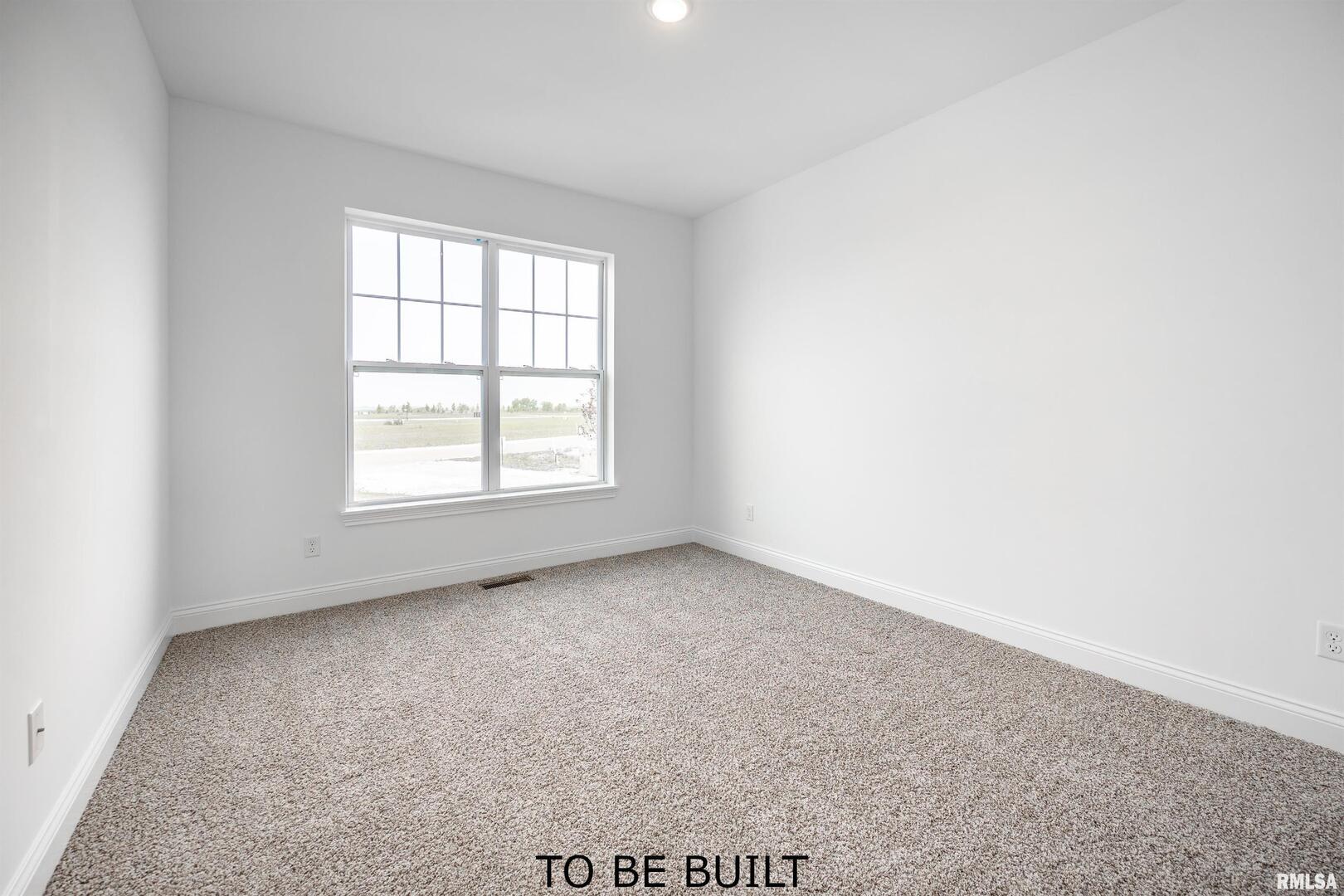 10 South 5th Street Eldridge, IA 52748 - Photo 21 of 29 an empty room with a window