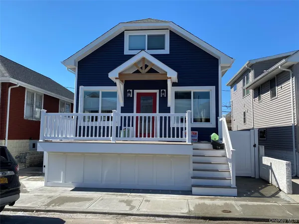 a view of a house with wooden deck