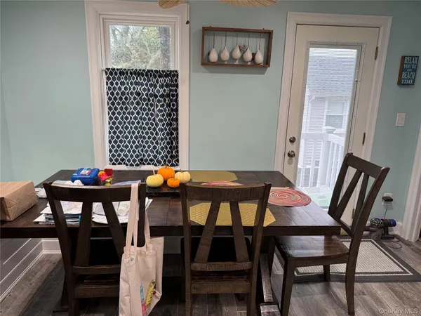 a view of a dining room with furniture and window