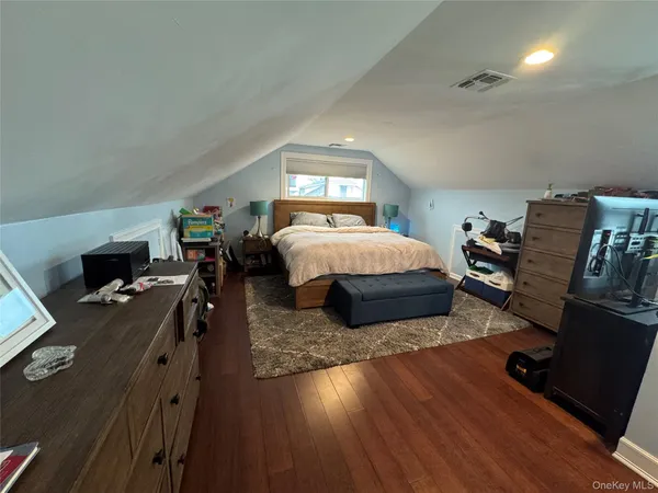 a bedroom with a bed and a desk