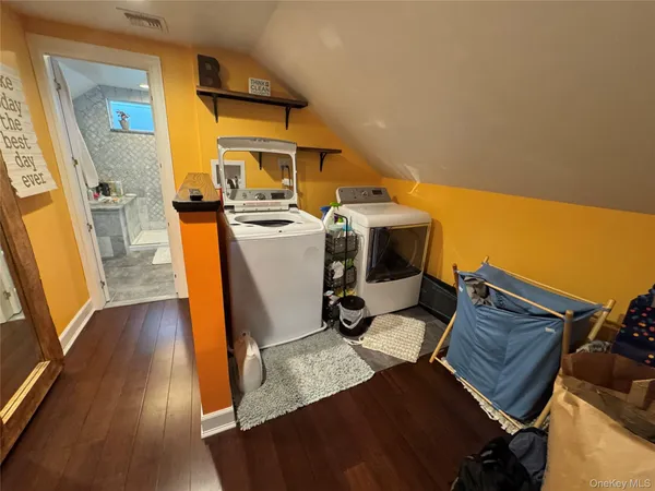 a view of kitchen with furniture and wooden floor