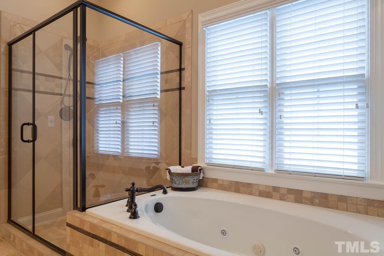 10331 Evergreen Spring Place Raleigh, NC 27614 - Photo 12 of 25 There is a ceiling fan in the master bath!