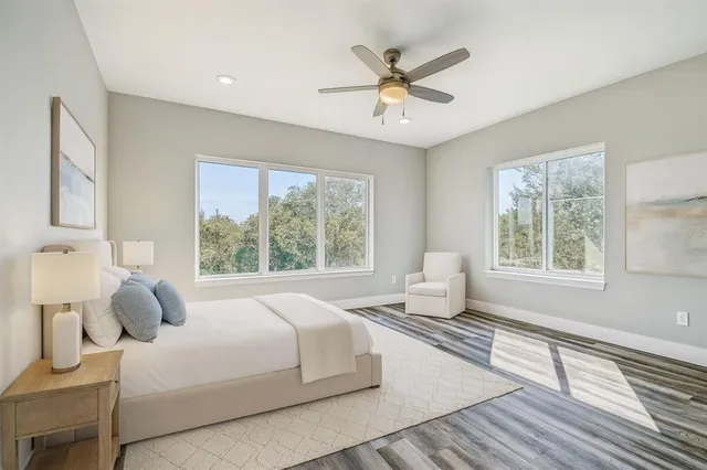 a bedroom with a bed and window