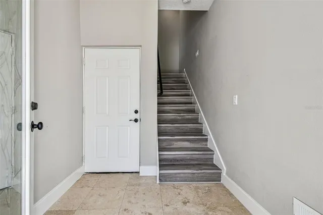 a view of a hallway with entryway