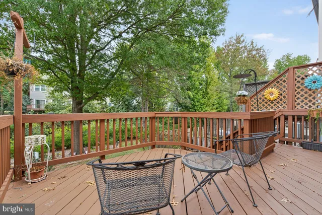 a view of balcony with wooden floor and seating space