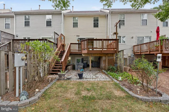 a view of house with a chairs in patio