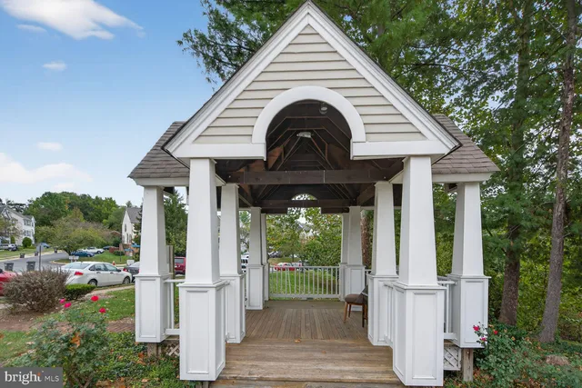 a view of a house with porch and garden