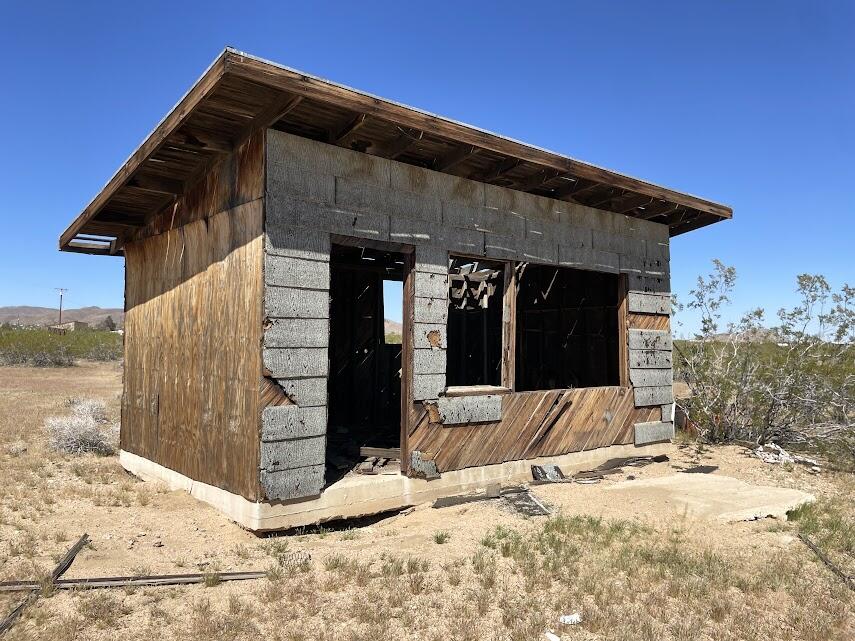 a view of a house with snow on the road