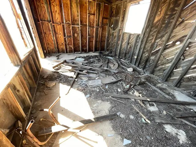 a view of a backyard with sitting area