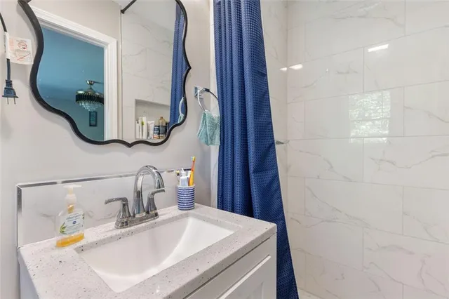 a bathroom with a sink and a mirror