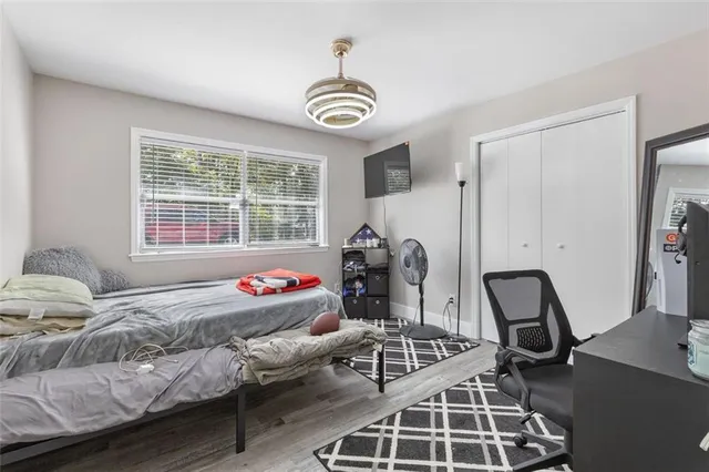 a bedroom with a bed and a window