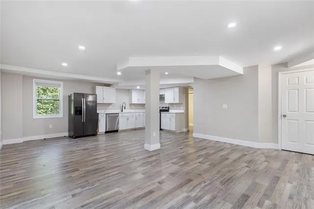 a view of a kitchen with a sink and a window