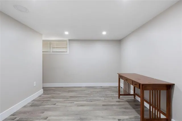a view of hallway with wooden floor