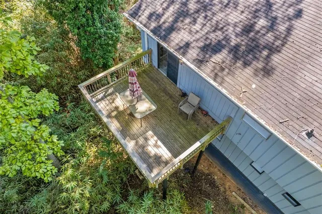 a view of a balcony with two chairs