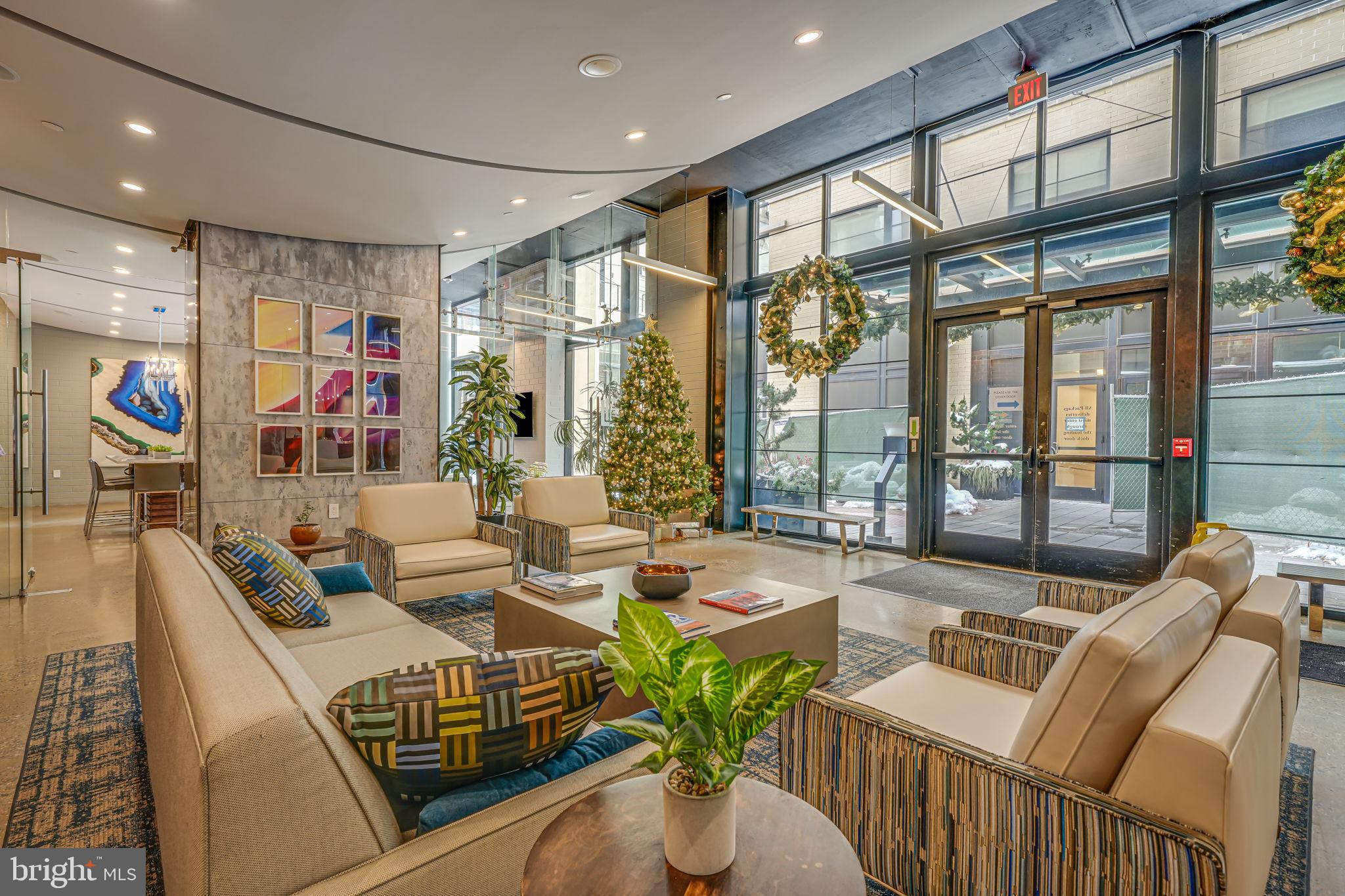 2125 14th Street Northwest, Unit 619 Washington, DC 20009 - Photo 11 of 22 a living room with furniture and a large window