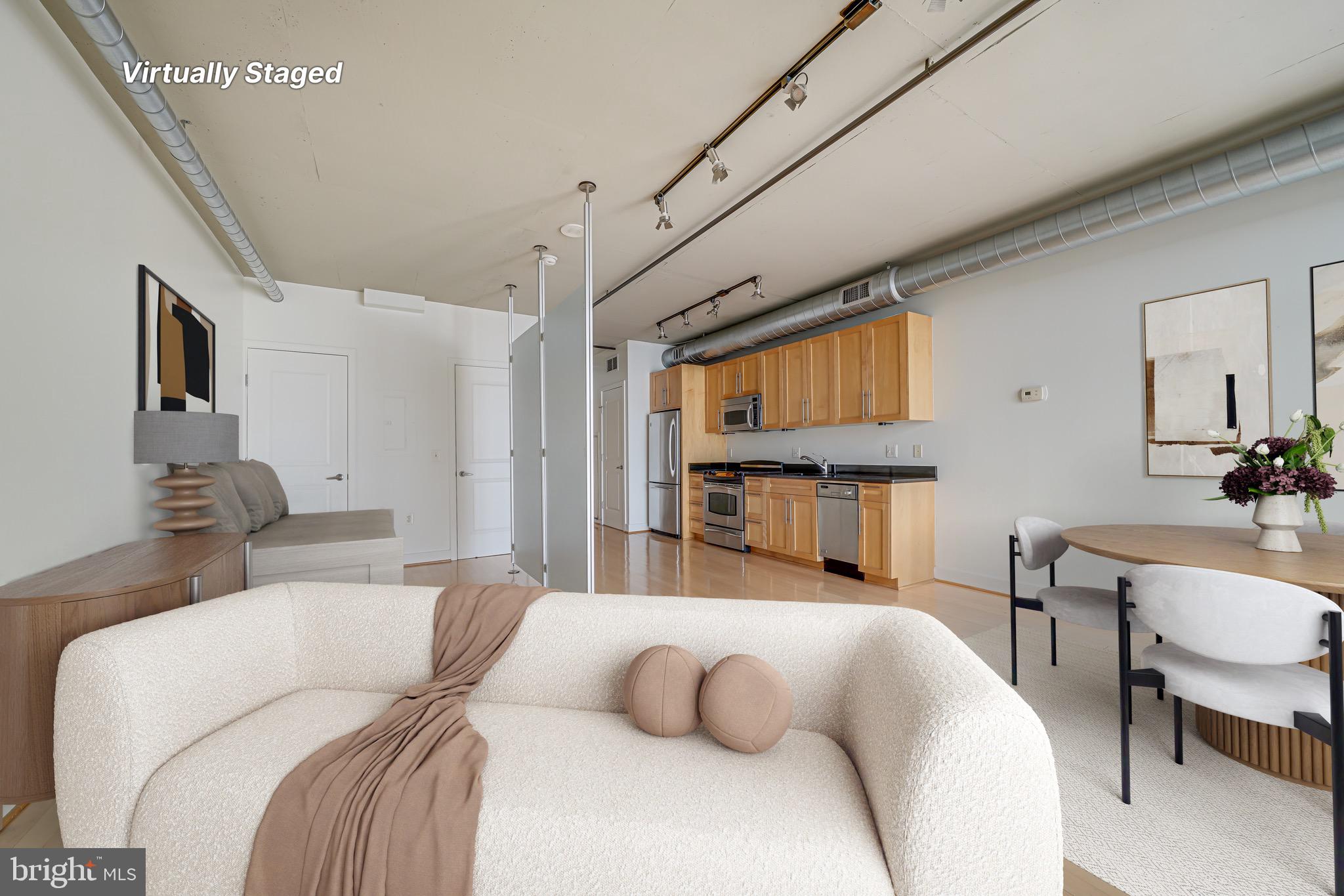 2125 14th Street Northwest, Unit 619 Washington, DC 20009 - Photo 4 of 22 a bed room with a bed and a chair