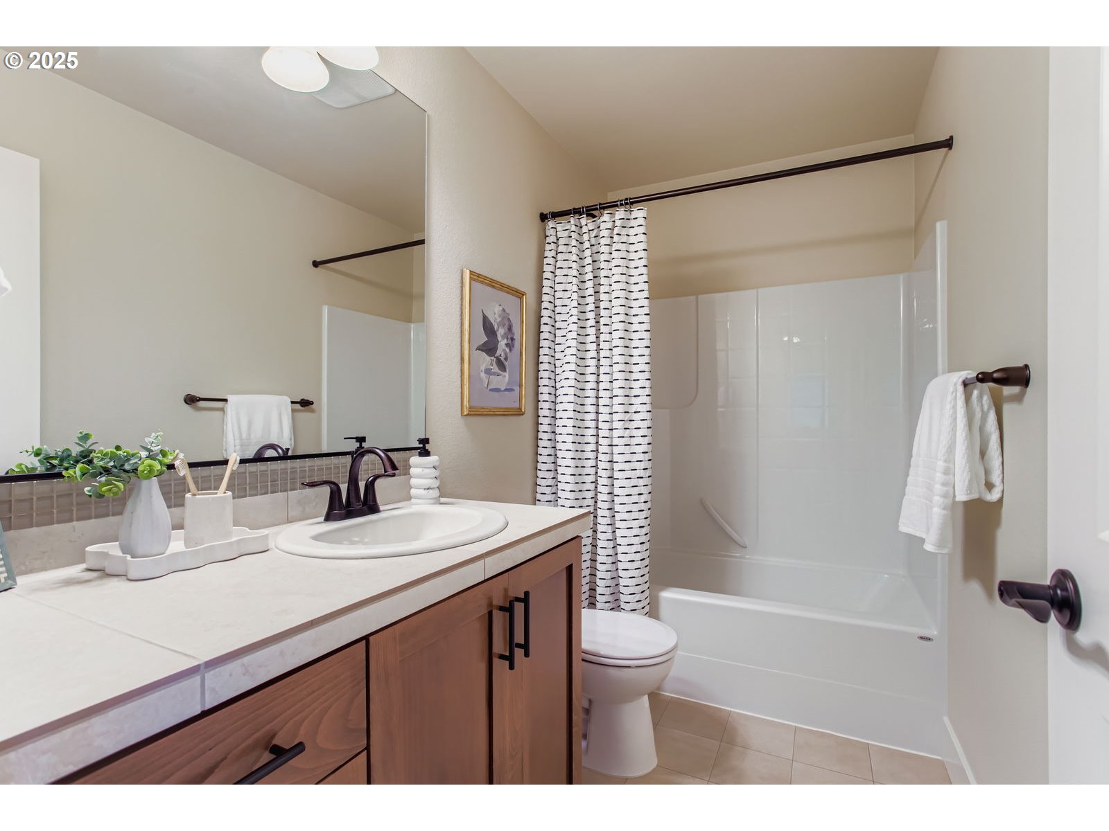 13575 Southwest Calabash Terrace Sherwood, OR 97140 - Photo 23 of 31 a bathroom with a sink toilet a mirror and shower