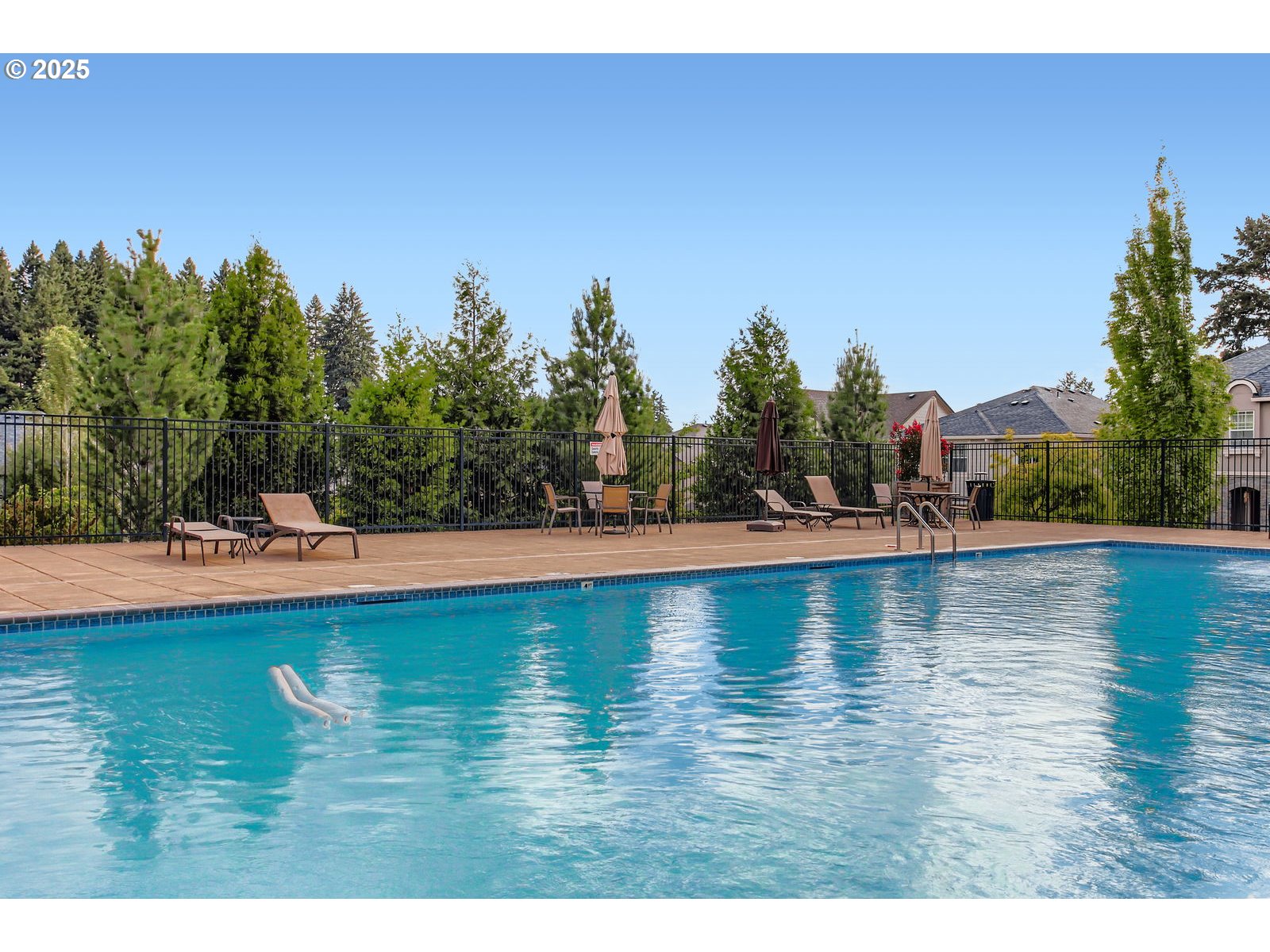 13575 Southwest Calabash Terrace Sherwood, OR 97140 - Photo 29 of 31 a view of swimming pool with outdoor space and trees in the background