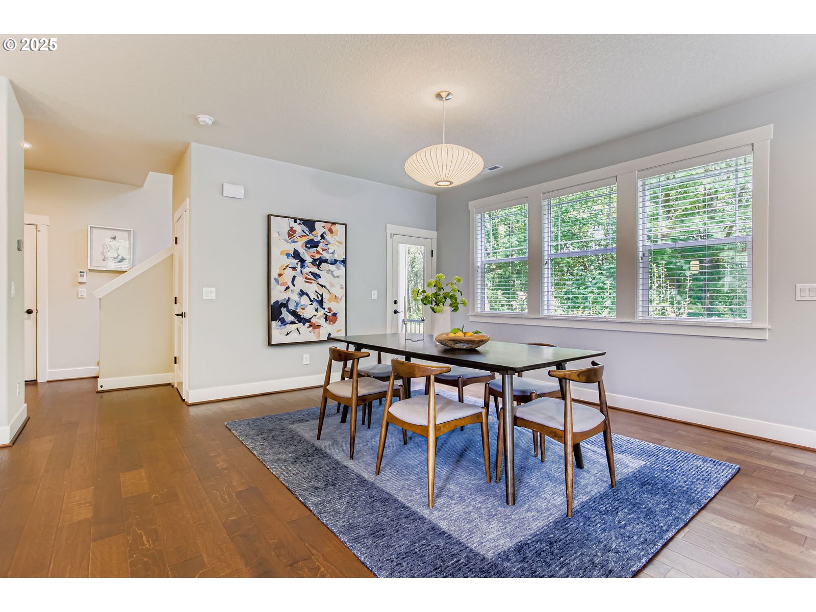 13575 Southwest Calabash Terrace Sherwood, OR 97140 - Photo 8 of 31 a dining room with furniture and wooden floor