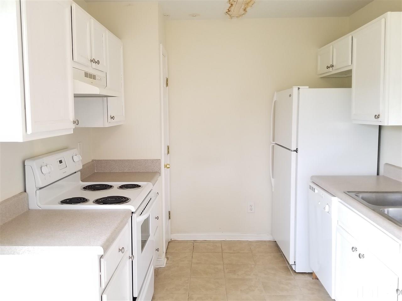 4321 Haverty Drive Raleigh, NC 27610 - Photo 5 of 5 a kitchen that has a sink a stove and a refrigerator