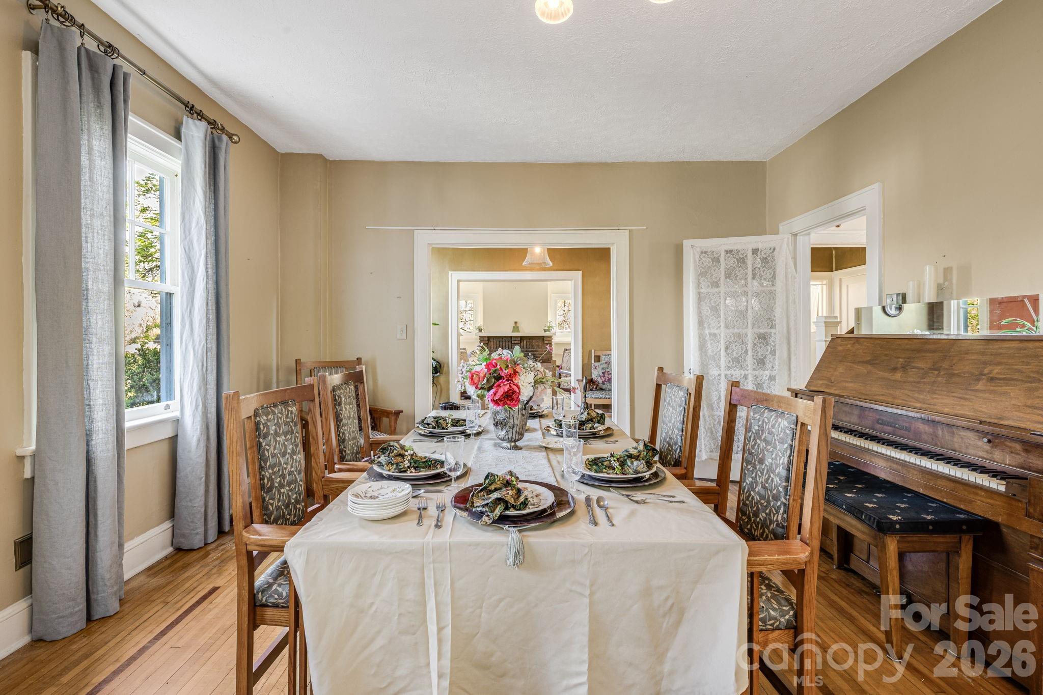 29 Walnut Street Hot Springs, NC 28743 - Photo 11 of 46 a view of a dining room with furniture window and wooden floor