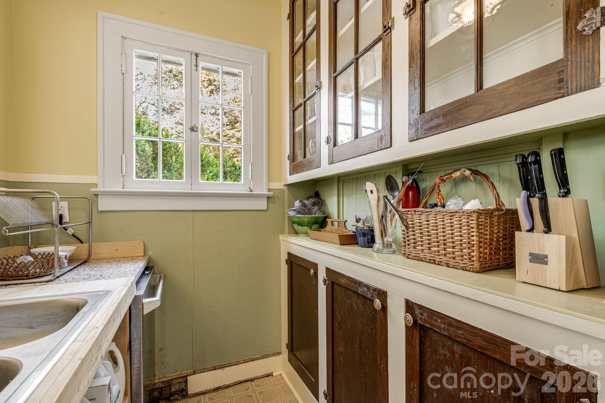 29 Walnut Street Hot Springs, NC 28743 - Photo 17 of 46 a kitchen with a sink cabinets and a window