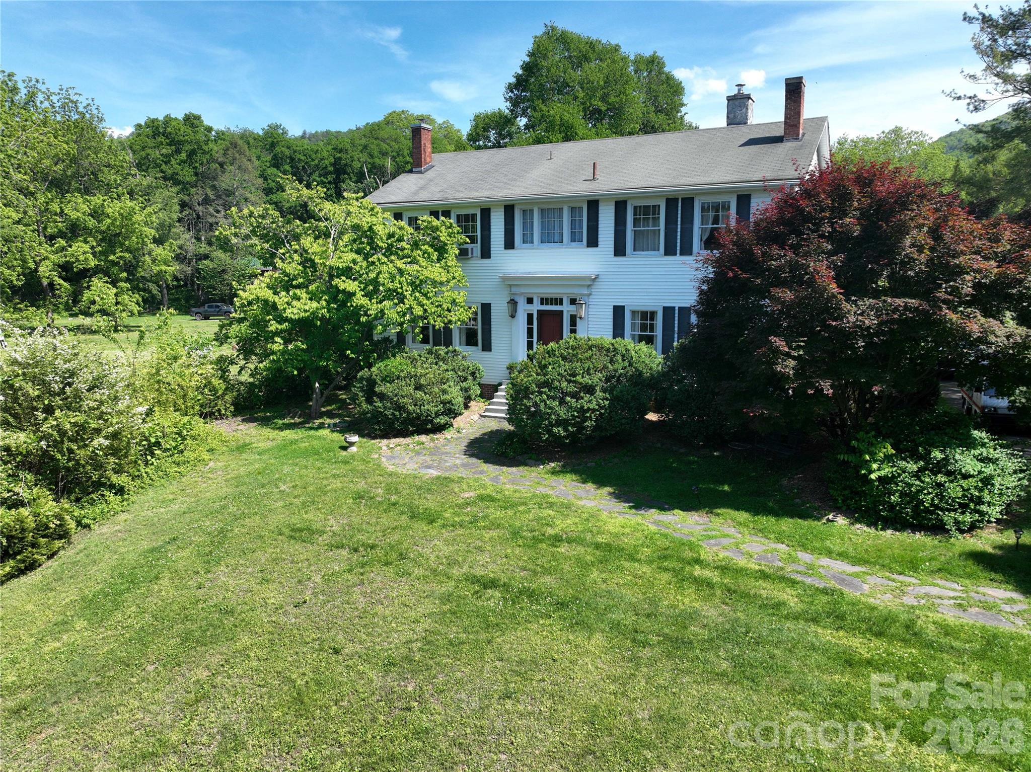 29 Walnut Street Hot Springs, NC 28743 - Photo 45 of 46 a view of a house with garden and yard