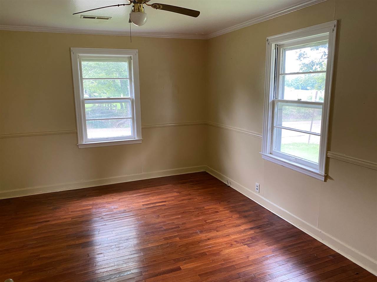331 East Ripley Avenue Covington, TN 38019 - Photo 4 of 12 Beautiful hardood floors throughout the house, including the dining room.