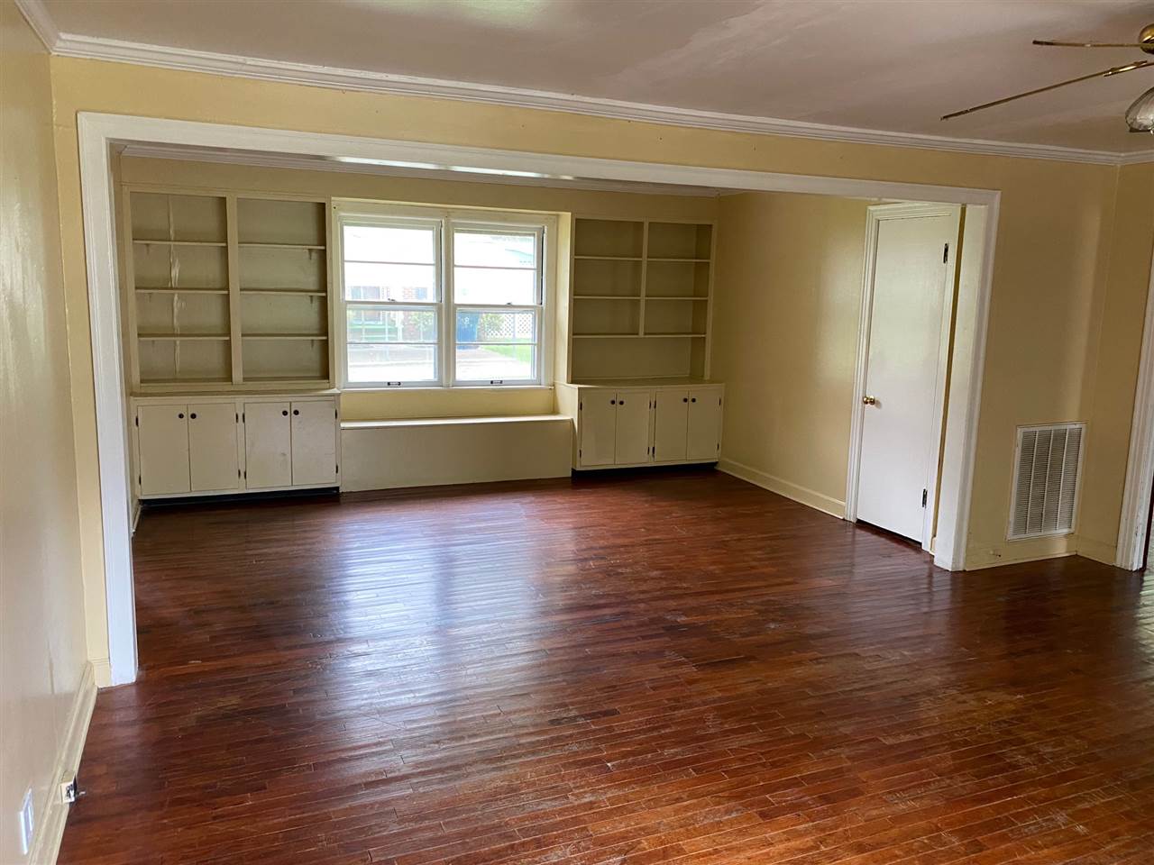 331 East Ripley Avenue Covington, TN 38019 - Photo 5 of 12 Living room has wonderful built-in bookshelves, as well as a nice window seat.
