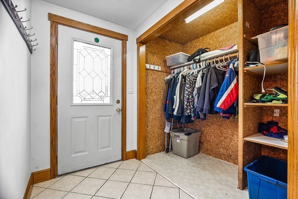 85 Pleasant Circle Canton, MA 02021 - Photo 11 of 35 a view of walk in closet with clothes and shoes