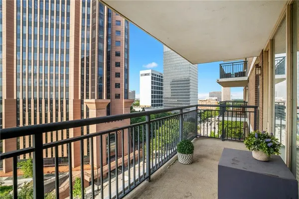a view of a balcony with chairs