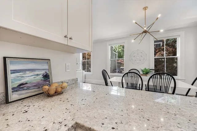 a bedroom with furniture and a large window