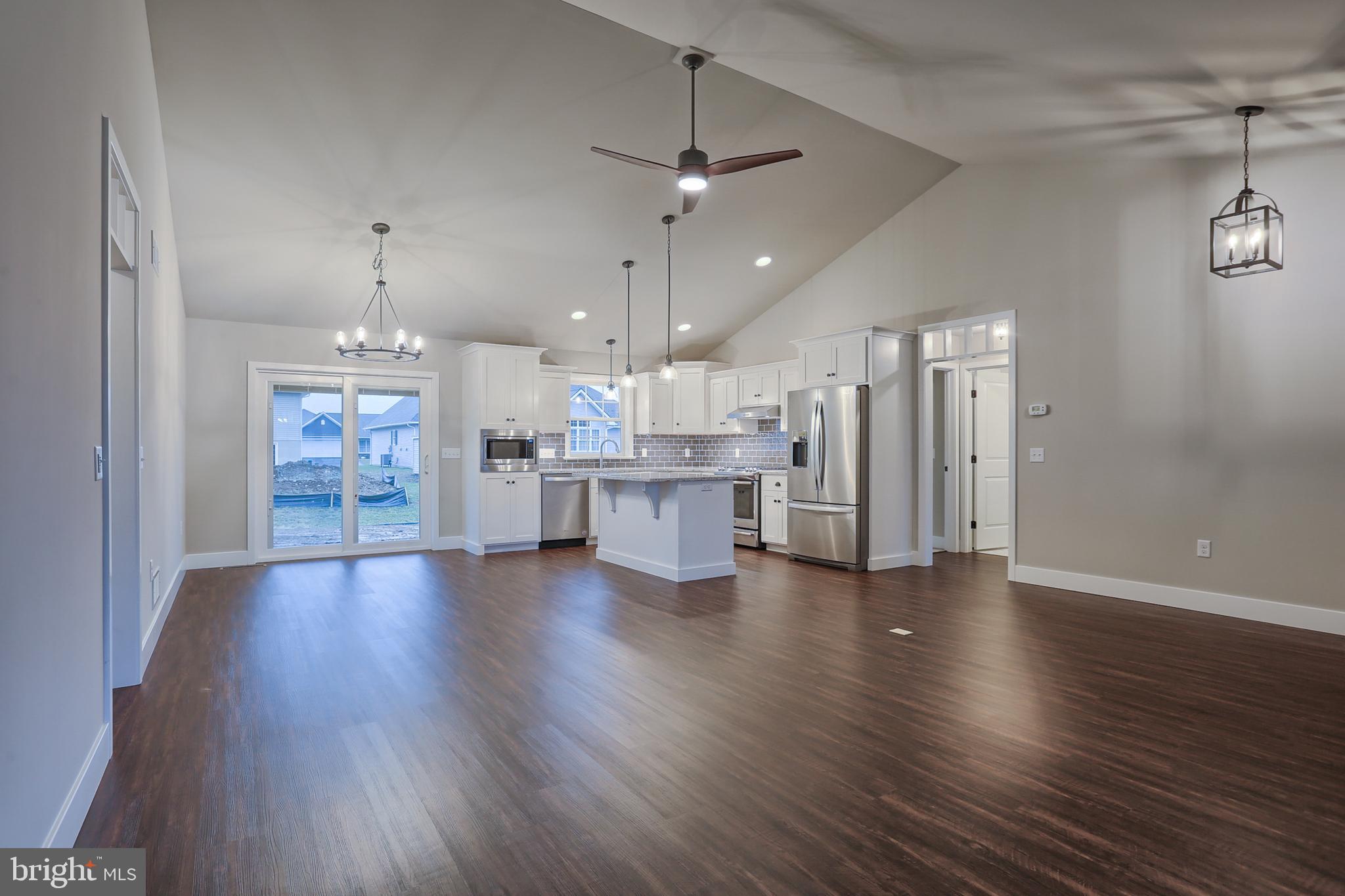 16 Rolling Meadow Road Lebanon, PA 17046 - Photo 2 of 21 an open kitchen with a refrigerator and a stove top oven